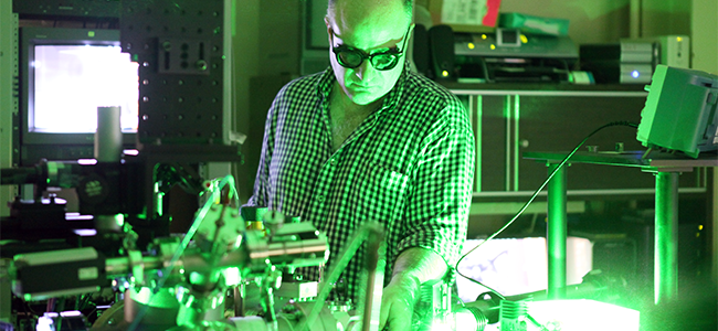 Inside the Laser Microprobe Laboratory: NASA scientist Simon Clemett (pictured) 
					conducting an experiment with the Laser Ablation, Laser Ionization Mass Spectrometer (L2MS). 
					This research tool is used to investigate the composition of organic matter in micron-scale 
					extraterrestrial materials.