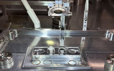 Po-210 source mounted to sample processing tray